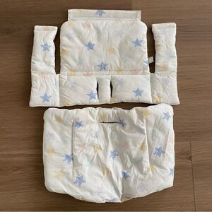 Stokke Tripp Trapp Classic Cushion in a white with multi-color stars pattern